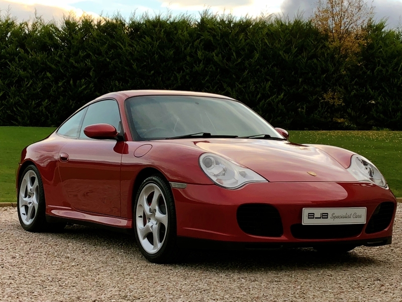 View PORSCHE 911 *SOLD* 996 CARRERA 4S COUPE. ORIENT RED METALLIC, BLACK LEATHER. RARE COLOUR, STUNNING.